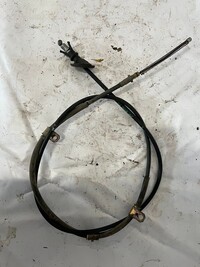 Трос стояночного тормоза левый 2WD